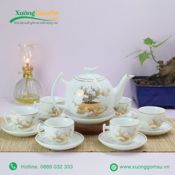 Bộ ấm chén nắp trăng khuyết vẽ vàng công đào